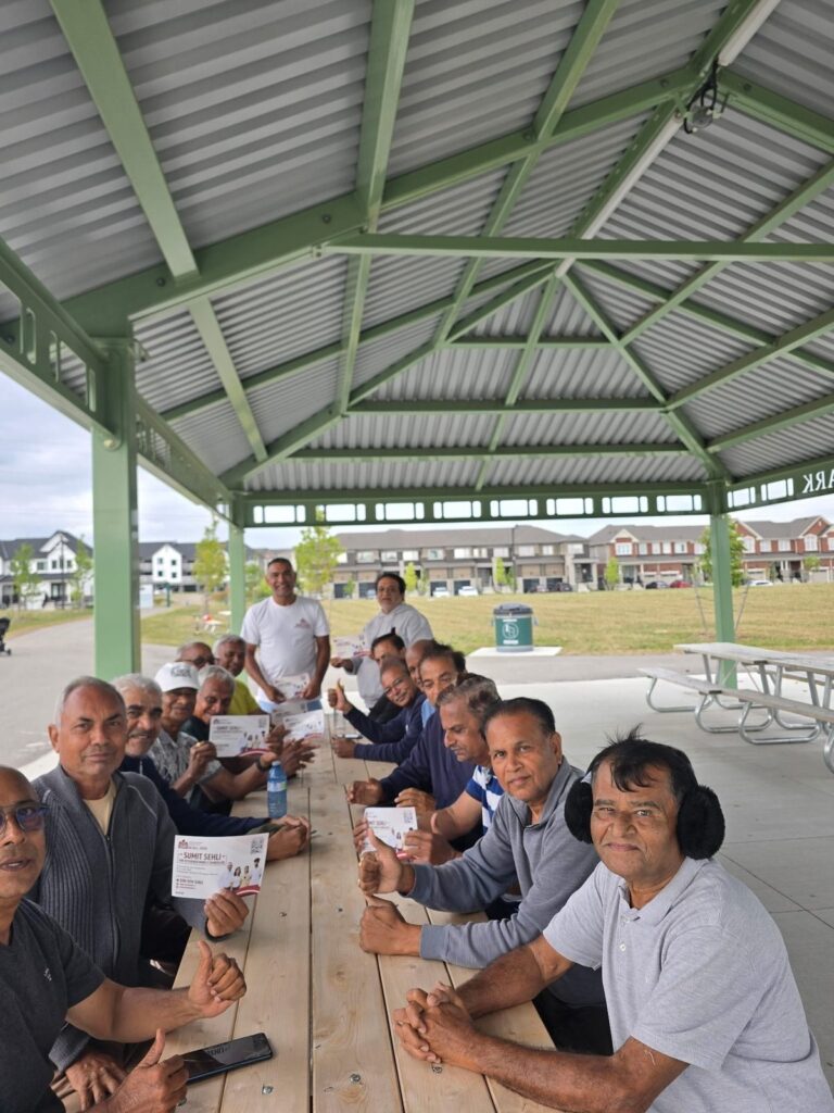 Sumit Sehli with neighbours and community members in Kitchener Ward 5, photo 38 of 71