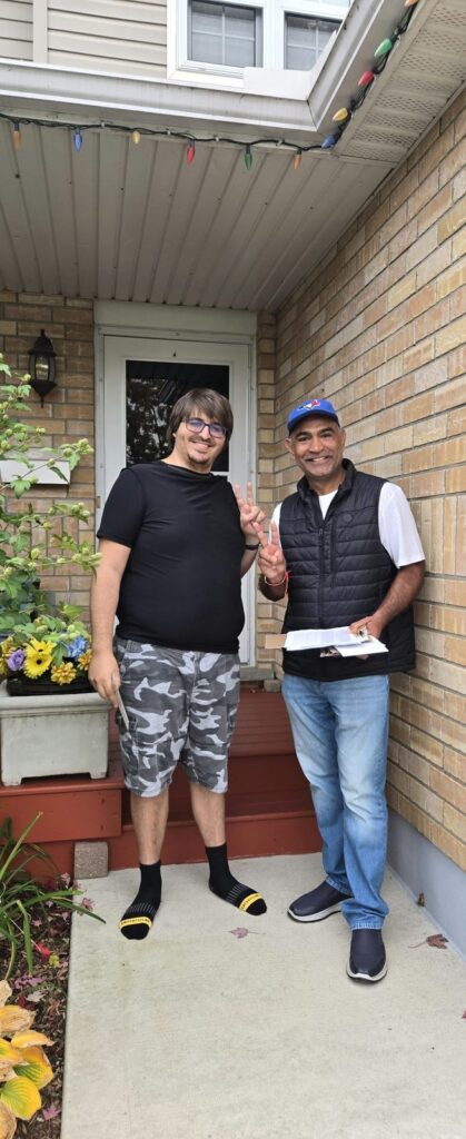Sumit Sehli with neighbours and community members in Kitchener Ward 5, photo 68 of 71
