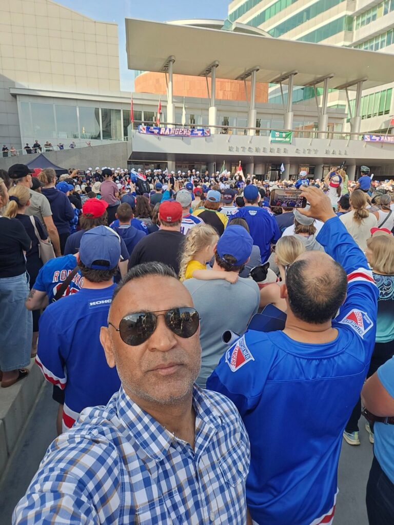 Sumit Sehli with Kitchener Rangers fans outside Kitchener City Hall